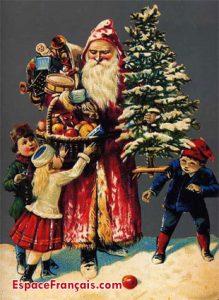 Le Père Noël distribue des cadeaux aux enfants. Ancienne carte postale (vers 1950).
